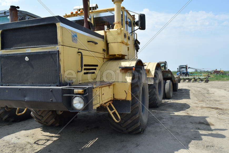 Russia, Temryuk - 15 July 2015: Tractor, standing in a row. Agricultural machinery. Parking of agric