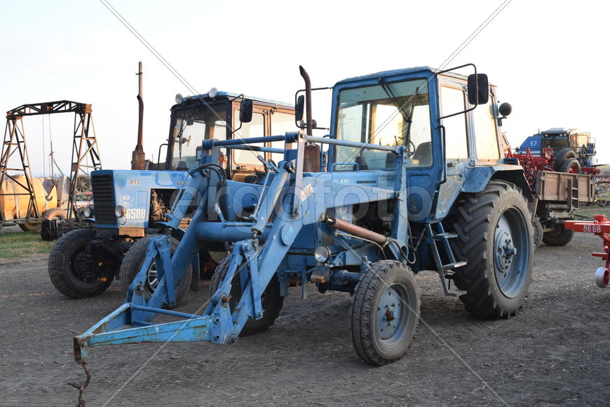 Russia, Temryuk - 15 July 2015: Tractor, standing in a row. Agricultural machinery. Parking of agric