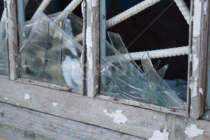 Windows with the broken glasses. The old thrown gas station