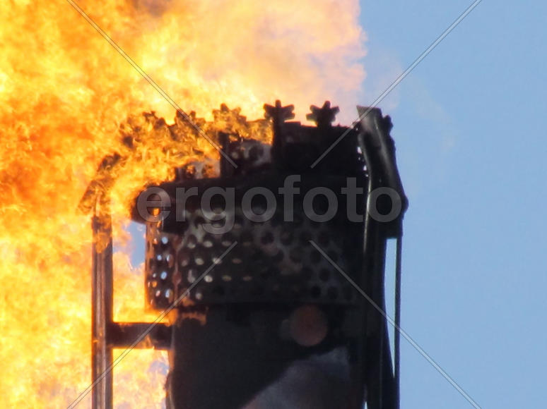 System of a torch on an oil field. Burning through a torch head