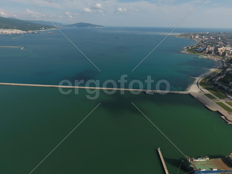 Top view of the bay Tsemess. The international sea port of Novorossiysk. Mol - building to stop the 