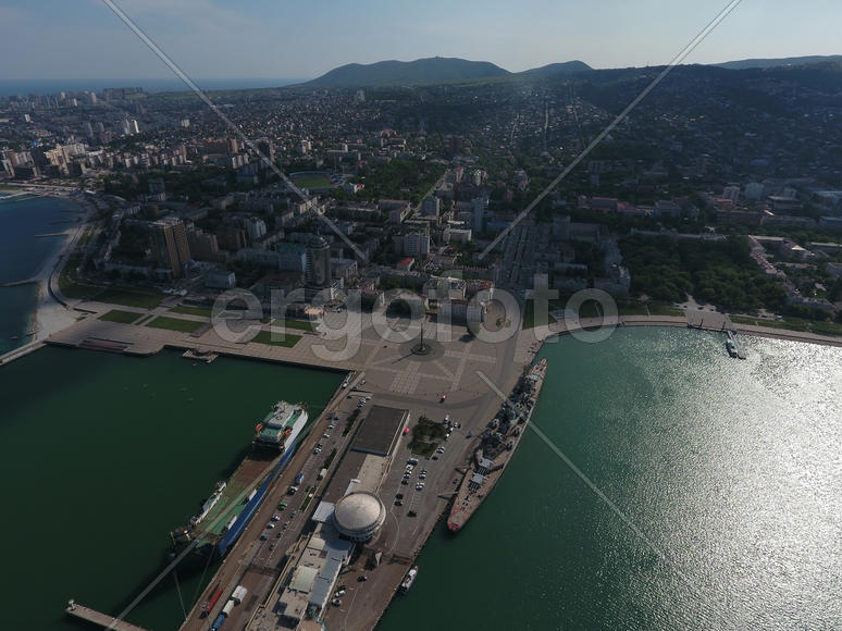 Top view of the marina and quay of Novorossiysk. Urban landscape of the port city.