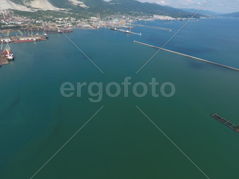 Top view of the bay Tsemess. The international sea port of Novorossiysk. Mol - building to stop the 
