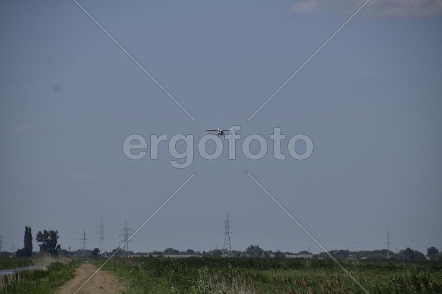 Aircraft agricultural aviation AN-2. The spraying of fertilizers and pesticides on the field with th