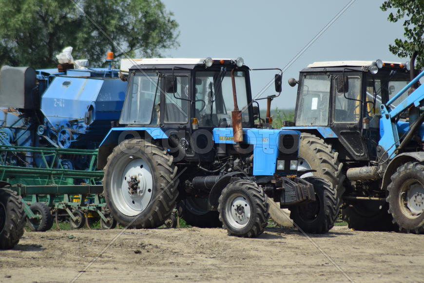 Russia, Temryuk - 15 July 2015: Tractor, standing in a row. Agricultural machinery. Parking of agric