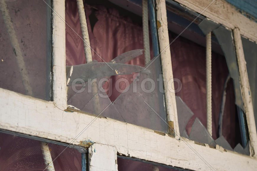 Windows with the broken glasses. The old thrown gas station