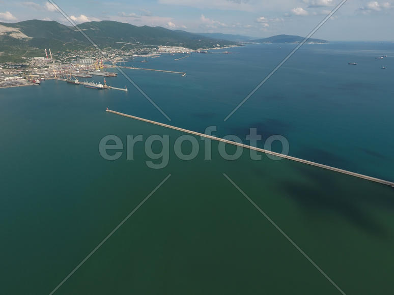 Top view of the bay Tsemess. The international sea port of Novorossiysk. Mol - building to stop the 