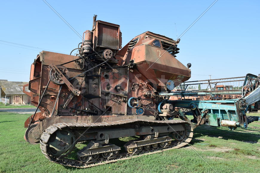 Tractor, standing in a row. Agricultural machinery. Parking of agricultural machinery.