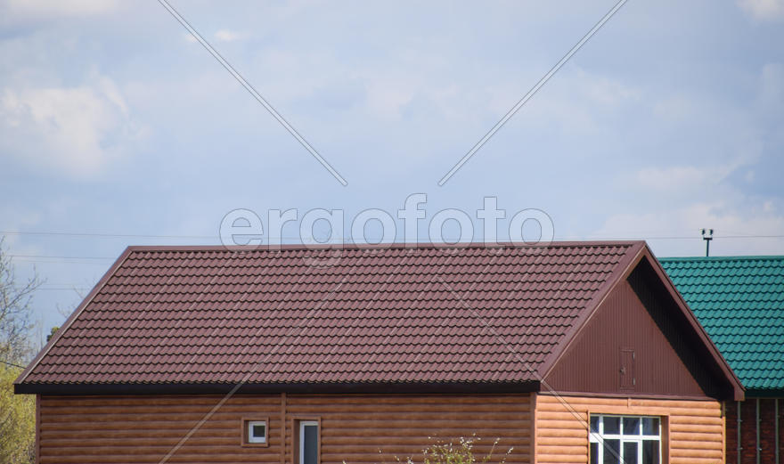 The roof of corrugated sheet on the houses. I