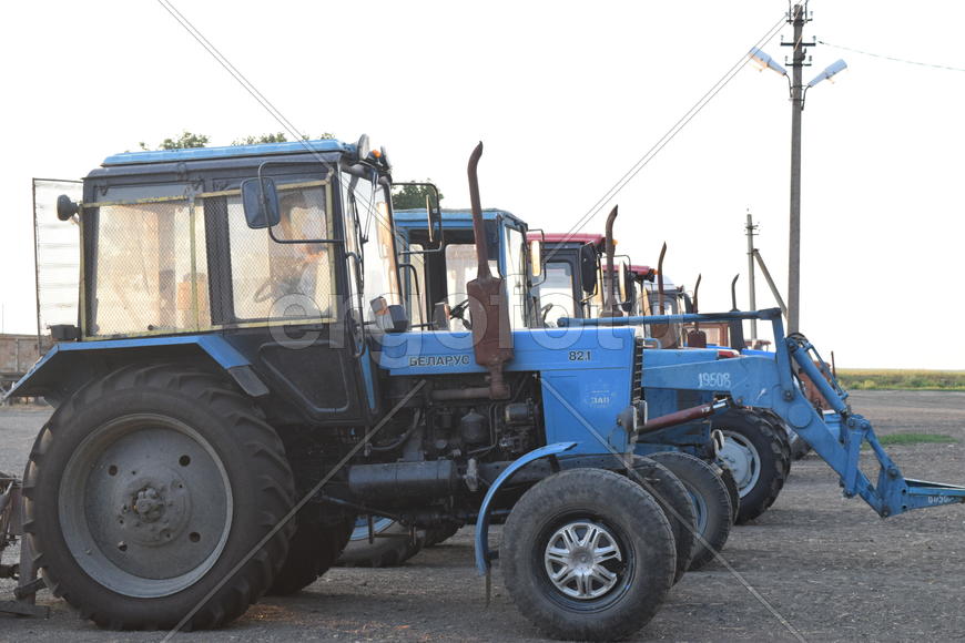 Russia, Temryuk - 15 July 2015: Tractor, standing in a row. Agricultural machinery. Parking of agric
