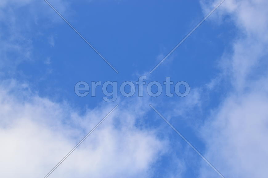 White cumulus clouds against the blue sky