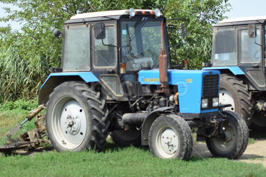 Russia, Temryuk - 15 July 2015: Tractor, standing in a row. Agricultural machinery. Parking of agric