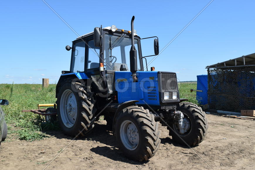 Russia, Temryuk - 15 July 2015: Tractor, standing in a row. Agricultural machinery. Parking of agric