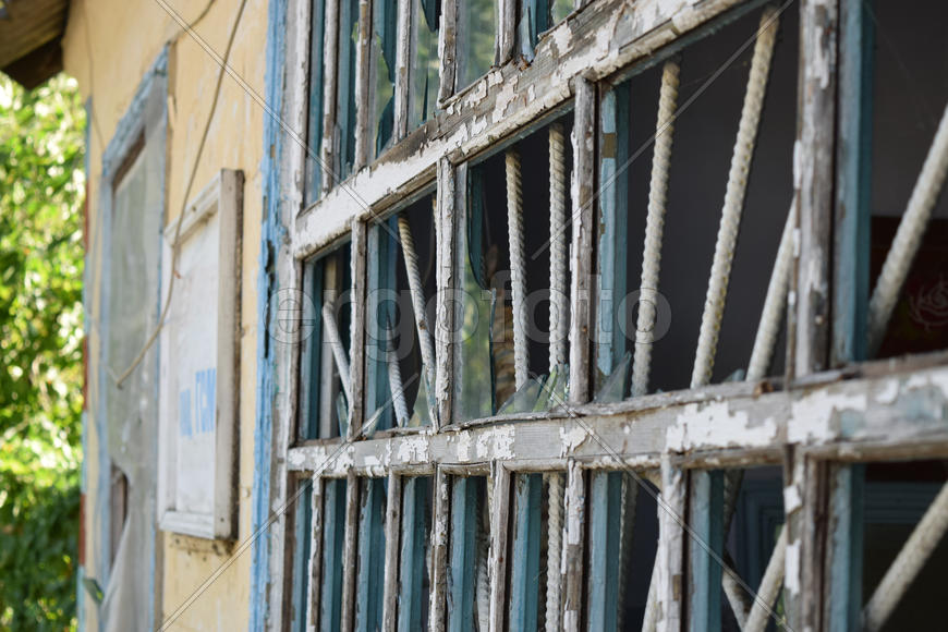 Windows with the broken glasses. The old thrown gas station