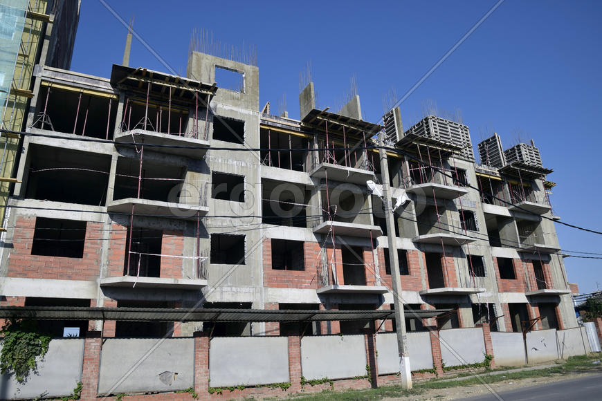 Construction of a multistory building. Installation of the concrete walls of the building.