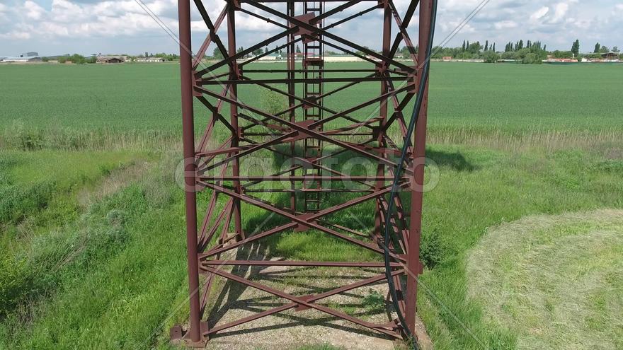 Rusty water tower. An old rustic communal communication.