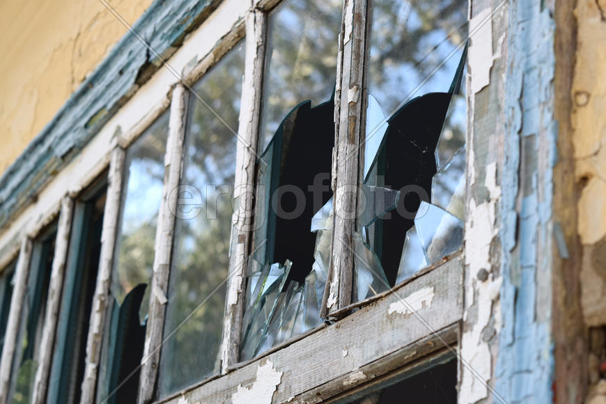 Windows with the broken glasses. The old thrown gas station