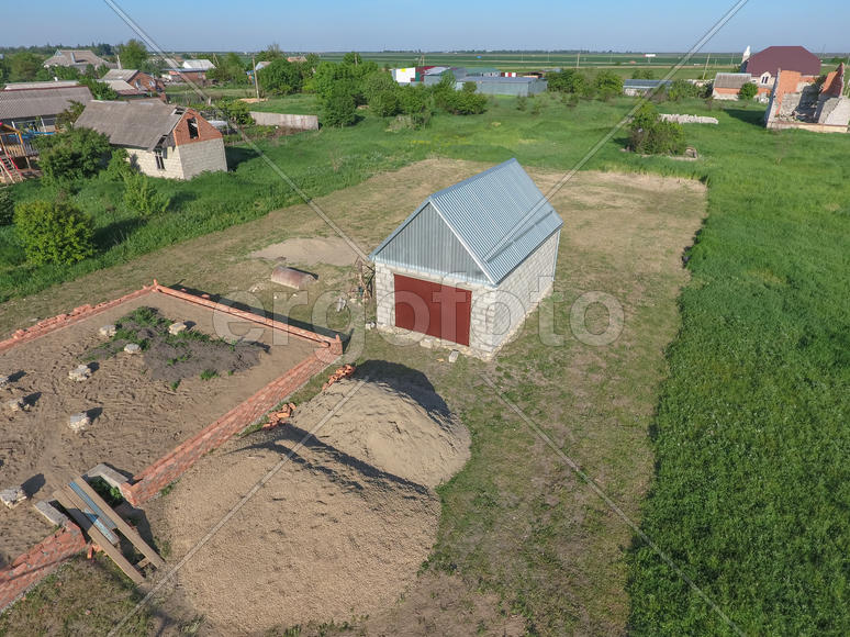 Top view of the garage in a private plot of land. Private construction.