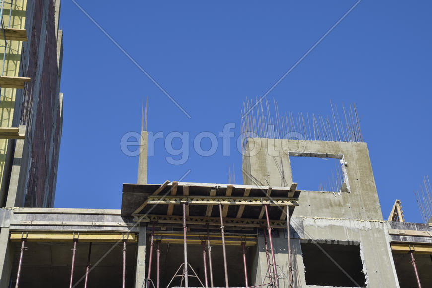 Construction of a multistory building. Installation of the concrete walls of the building.
