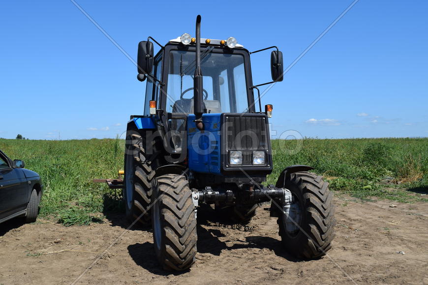 Russia, Temryuk - 15 July 2015: Tractor, standing in a row. Agricultural machinery. Parking of agric