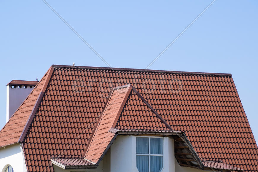 The roof of corrugated sheet. Roofing of metal profile wavy shape.