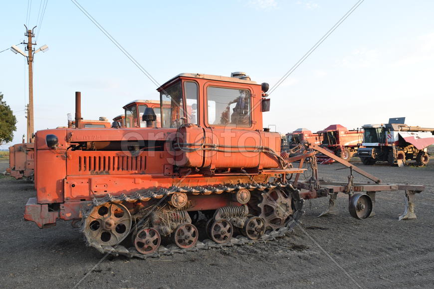 Russia, Temryuk - 15 July 2015: Tractor, standing in a row. Agricultural machinery. Parking of agric