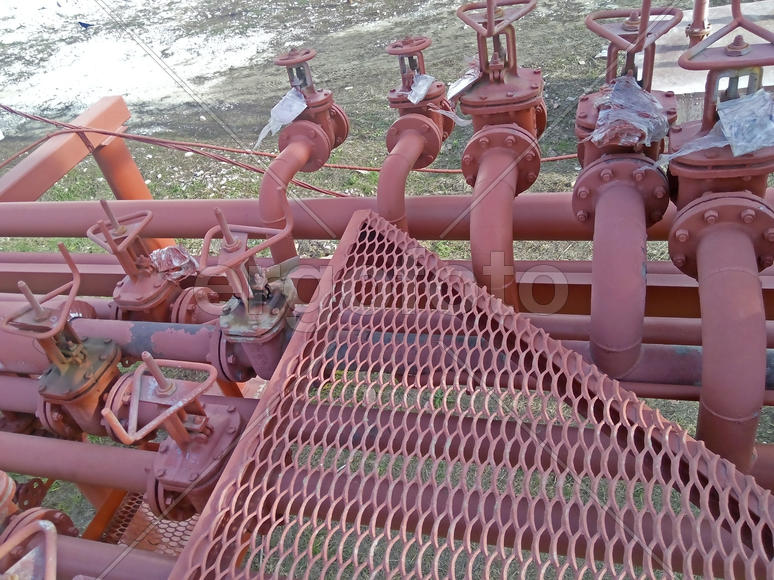 Valves on the pipeline for pumping oil. Pipes at the refinery                            