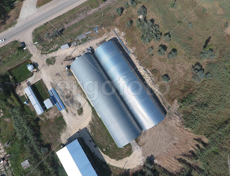 Top view of the hangars. Hangar of galvanized metal sheets for the storage of agricultural products 