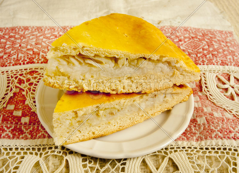 Two pieces of cake with a fish lying on a plate