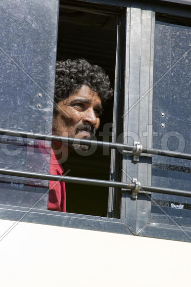 A passenger bus in the Indian looked through the open window to the street