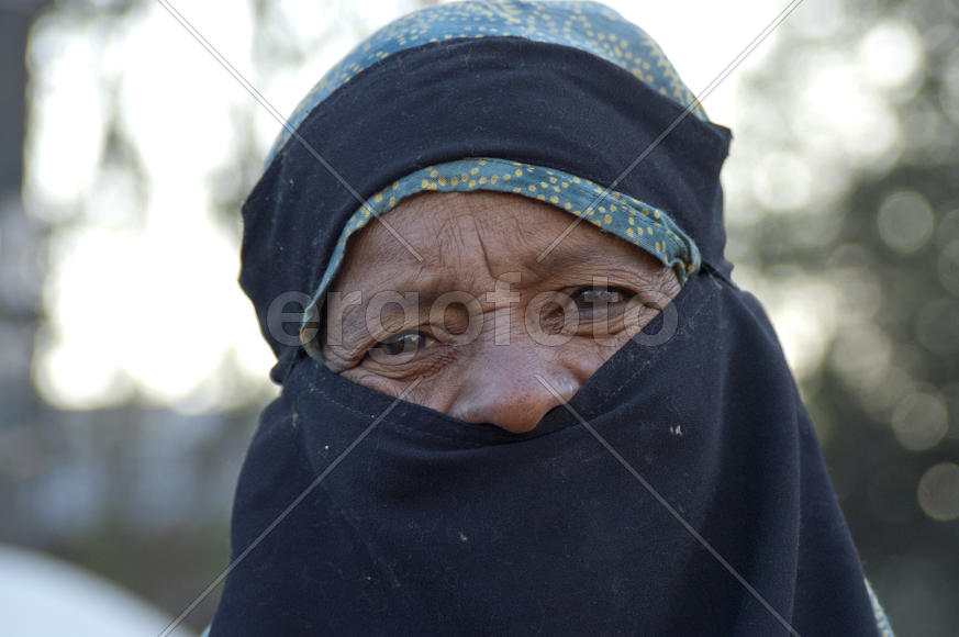 Eyes of an elderly woman in a burqa on the street in Karachi
