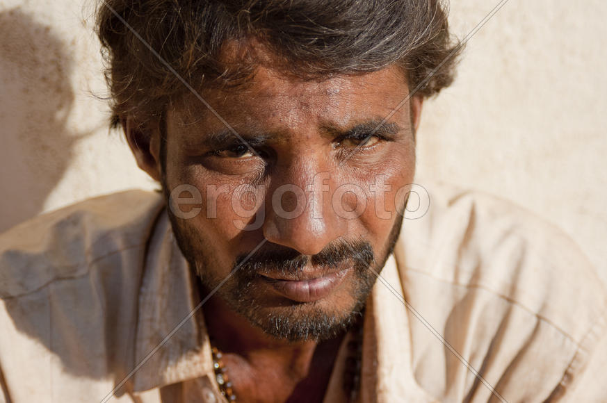 the face of a beggar in the old temple near Goa