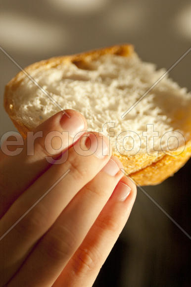 Hand with slice of bread