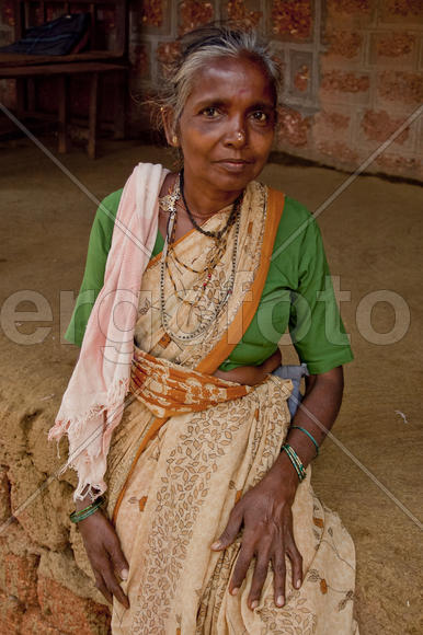 Woman in colorful saris sat on the ledge