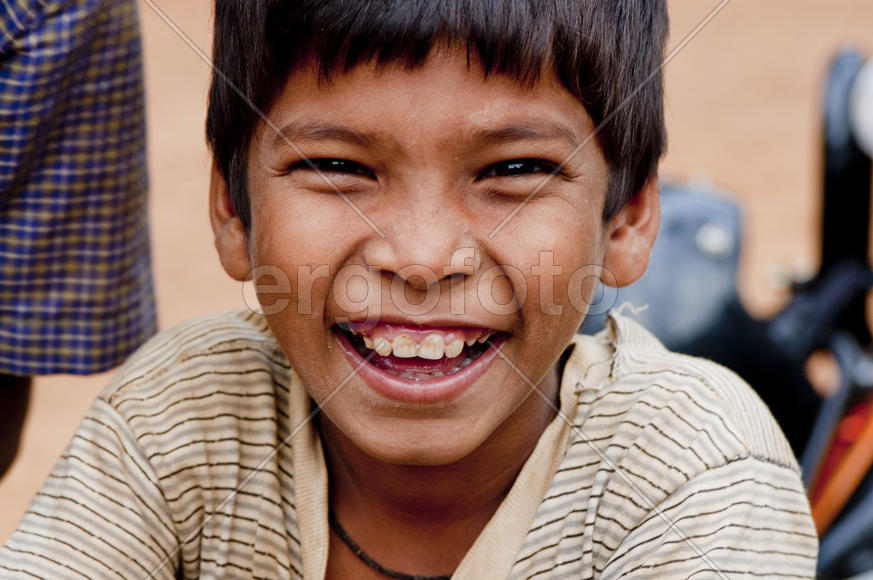Laughing face of a village boy
