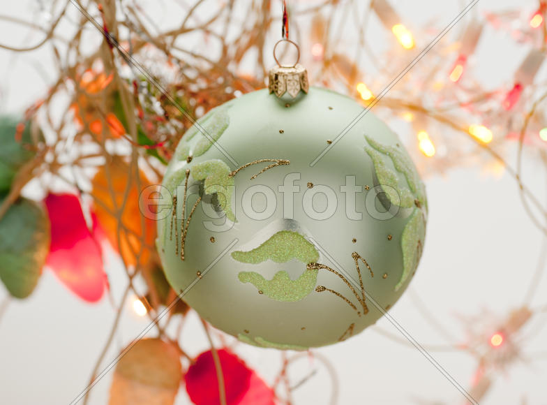 Green Christmas toy in the shape of a ball