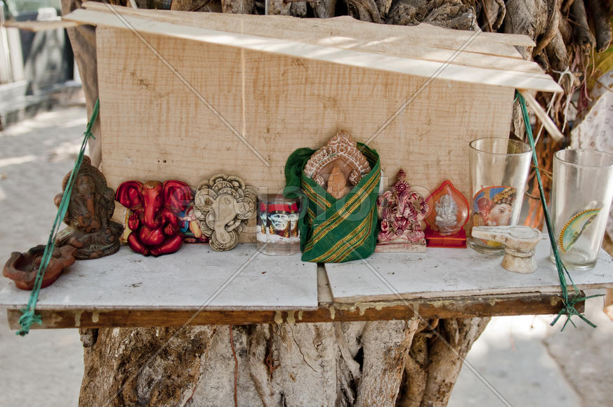 Figurines of Hindu gods and a portrait of Sai Baba of Shira