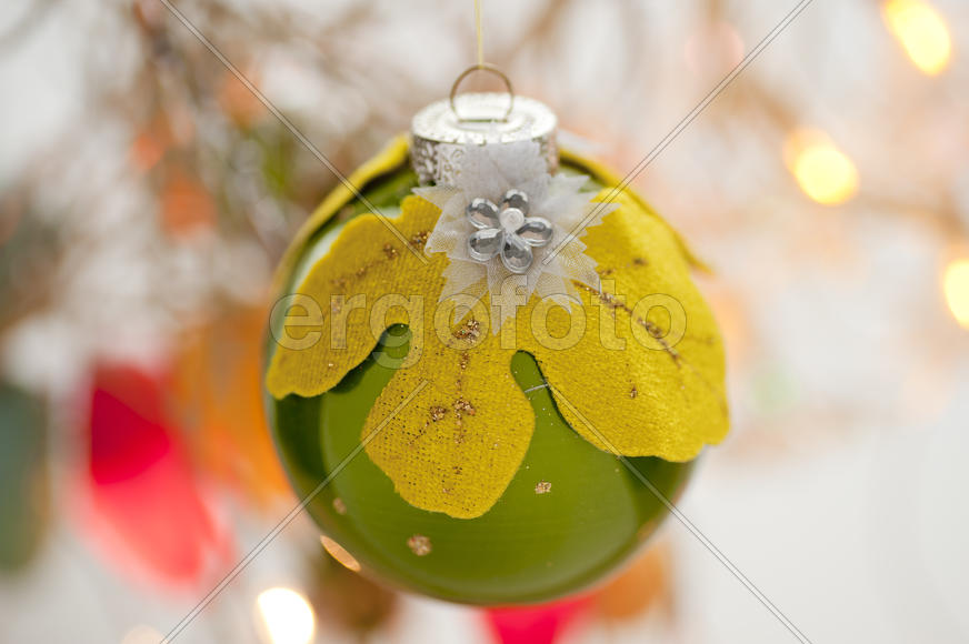 Green Christmas toy in the shape of a ball