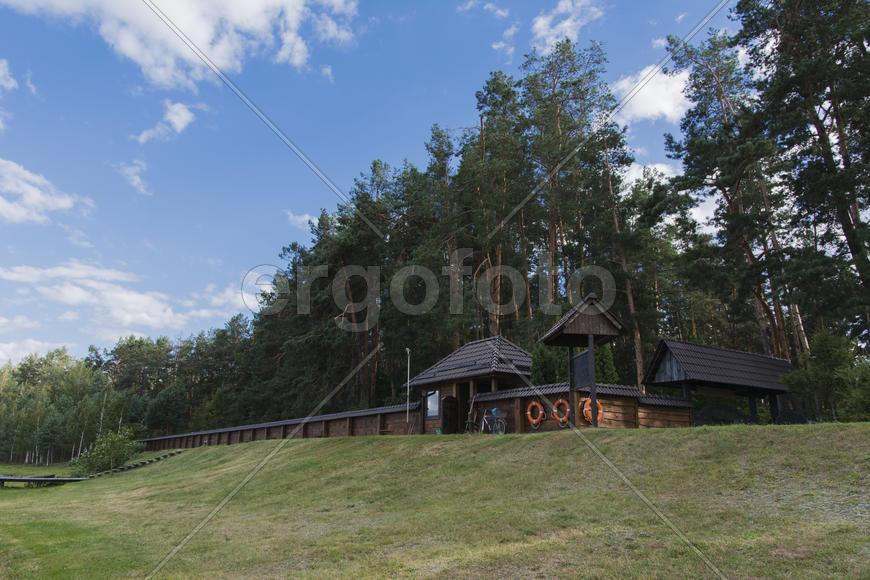 Wooden fence enclosing the recreation area on the lake