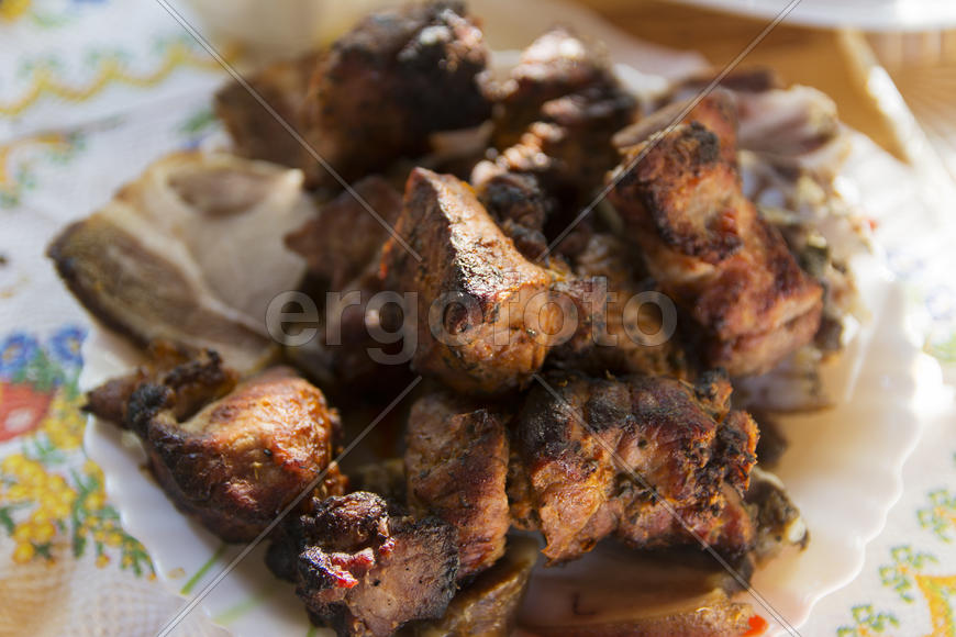 Shish kebab on skewers. Cooking meat on the coals.