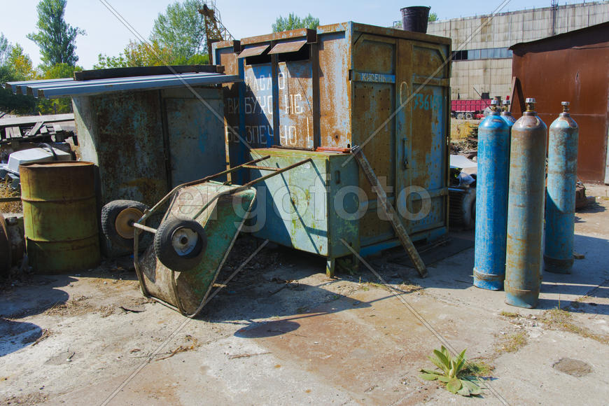 Old rusty engine in an abandoned factory in the industrial zone