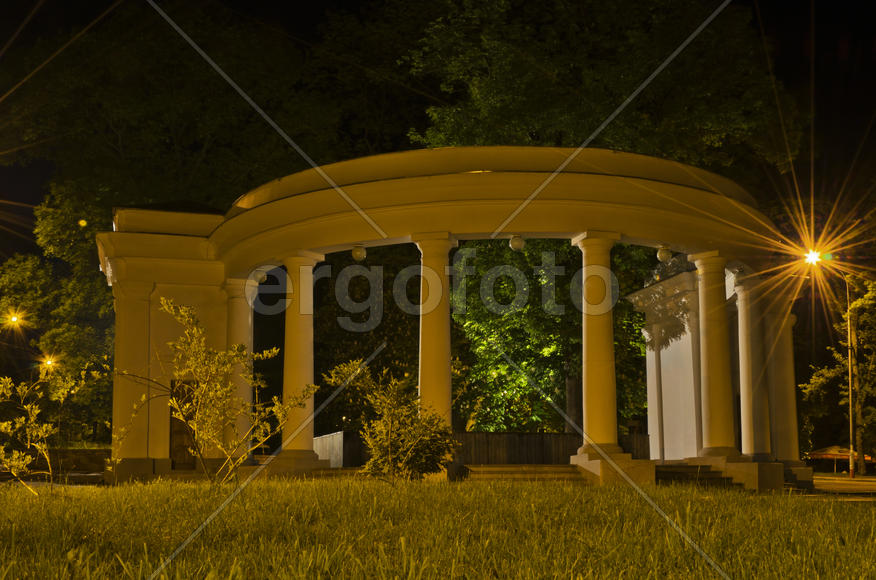 Illuminated Arch in night city park
