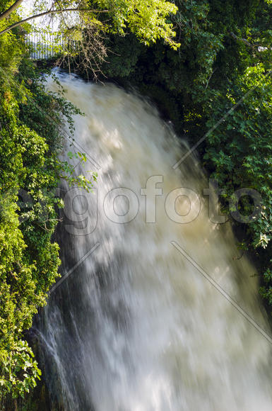 Waterfall. drop of water in the river from the ledge. The sharp drop height of the riverbed and a st