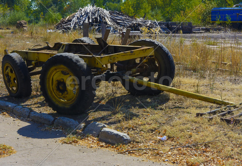 The old wheel axle in an abandoned factory in the industrial zone