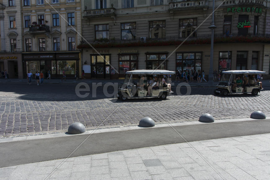 A little courtesy car. Cobblestones on the pavement of the city