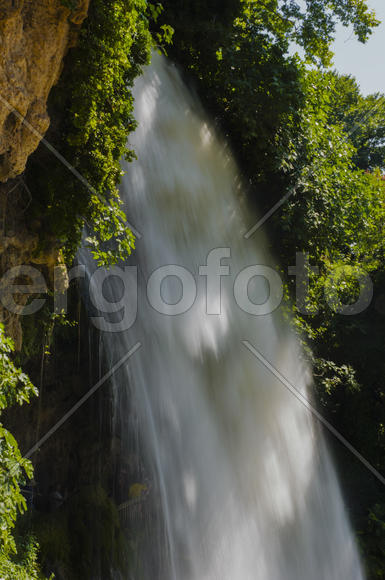 Waterfall. drop of water in the river from the ledge. The sharp drop height of the riverbed and a st