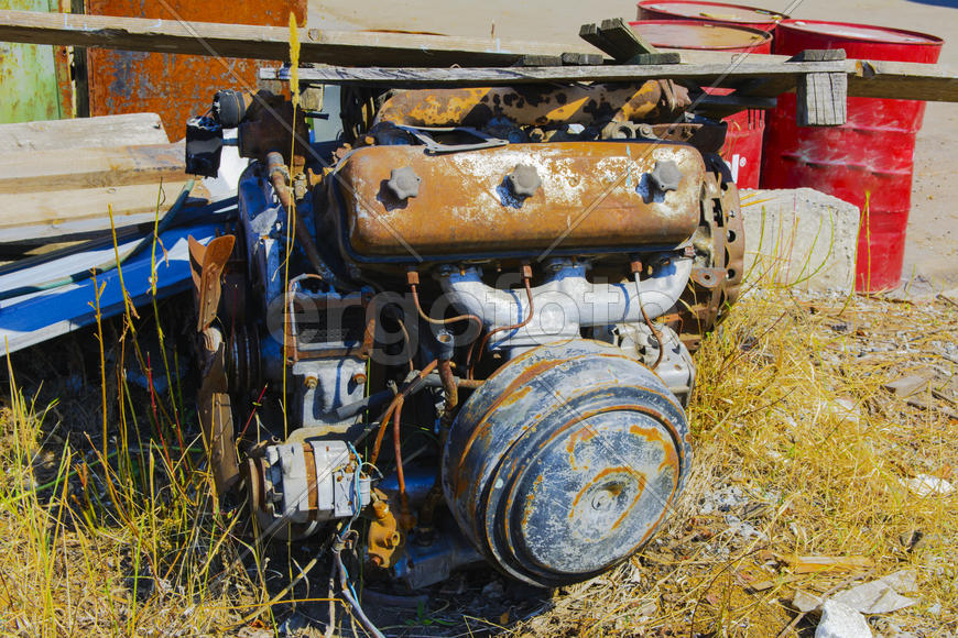Old rusty engine in an abandoned factory in the industrial zone