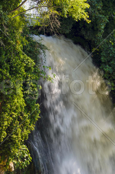 Waterfall. drop of water in the river from the ledge. The sharp drop height of the riverbed and a st