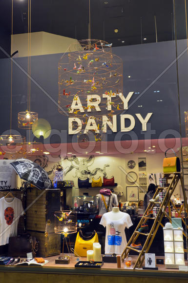 A shop window of different products. Mixed exhibit showcases products of various groups.