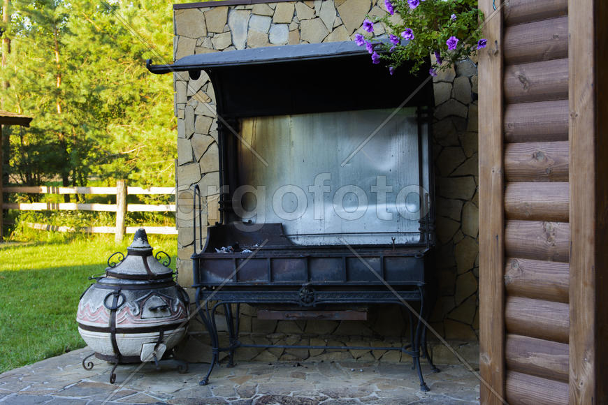 Barbecue near the wall of a private house